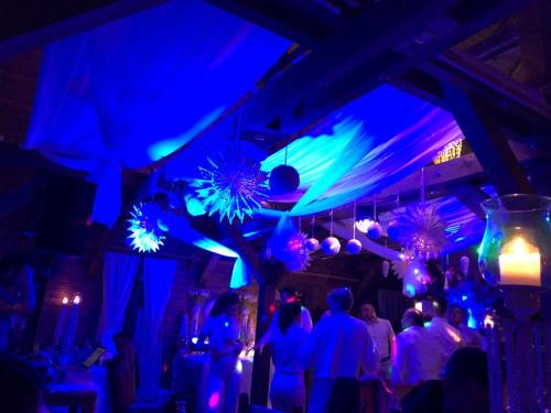 a group of people in a room with blue lights at Ethno Houses Plitvice Lakes Hotel in Plitvica selo