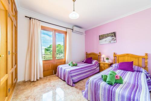 Ένα ή περισσότερα κρεβάτια σε δωμάτιο στο Ideal Property Mallorca - Can Paris