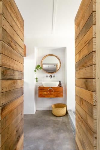 a bathroom with a sink and a mirror at Arendsig Wine Estate & Cottages in Bonnievale