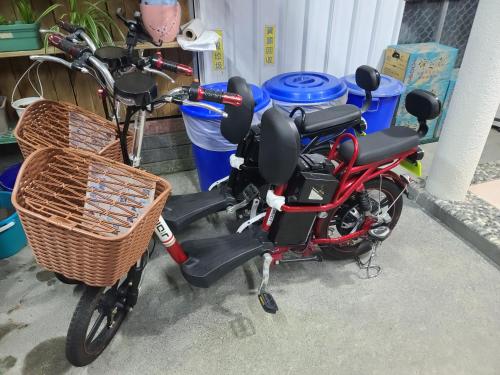 a red scooter with a basket on the back at Fire B&B in Chishang