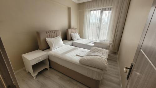 Postel nebo postele na pokoji v ubytování Padishah Suite Otel