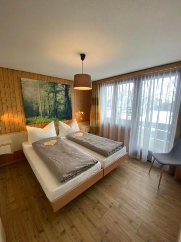 Postel nebo postele na pokoji v ubytování Hotel Garni Jägerhof