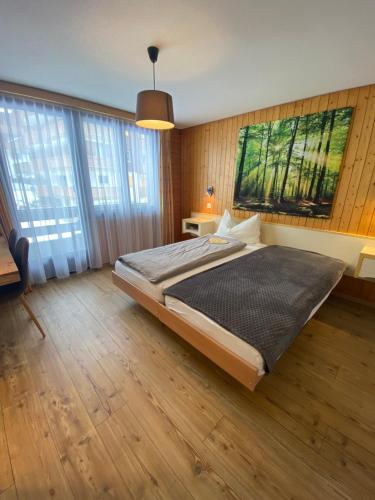 Postel nebo postele na pokoji v ubytování Hotel Garni Jägerhof