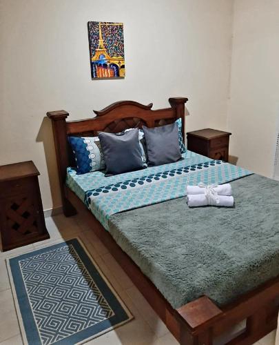 a bedroom with a bed with two towels on it at Araucarias Inn in Santa Rosa de Cabal