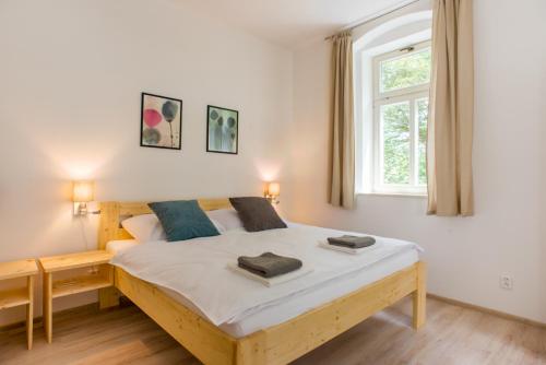 Postel nebo postele na pokoji v ubytování Apartmány Pstruží AP19