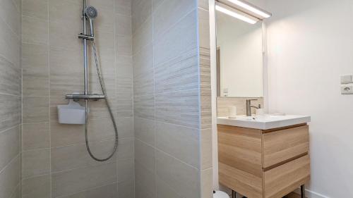 a bathroom with a shower and a sink at L'Orée du bois in Selongey