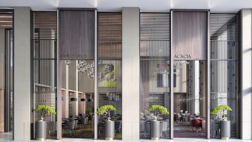 a rendering of a restaurant with plants in the lobby at Holiday Inn & Suites - Al Khobar by IHG in Al Khobar