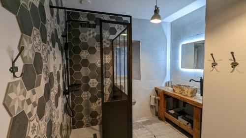 a bathroom with a shower and a sink at La Ferme du Château in Beire-le-Châtel