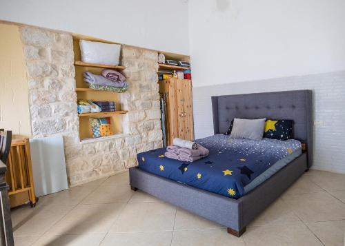 a bedroom with a bed with stars on it at Inn Tzfat in Safed