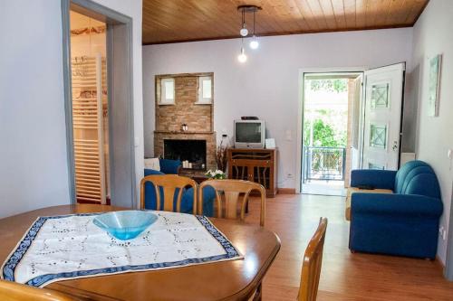 a living room with a table and a dining room at angelikashouse,big house in Corfu Town