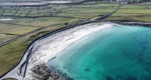 an aerial view of a beach and the ocean at Aran Islands Hotel in Kilronan