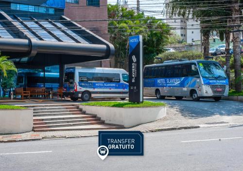Transfer (aeroporto).cls-2{fill:#ff8000}.cls-3{fill:#febb02}.cls-5{fill:#c00}.cls-7{fill:#514d9e}Travel Proud Slaviero Guarulhos Aeroporto Menor preço em Transfer (aeroporto).cls-2{fill:#ff8000}.cls-3{fill:#febb02}.cls-5{fill:#c00}.cls-7{fill:#514d9e}Travel Proud Slaviero Guarulhos Aeroporto