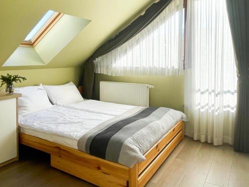 Posteľ alebo postele v izbe v ubytovaní VisitZakopane - Lord Apartment