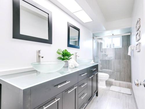 a bathroom with a sink and a toilet at Modern Spacious 5-Bedroom Home with Pool in Hollywood