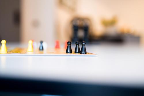 a group of chess pieces on a table at Max Lodging Serviced Apartments in Munich