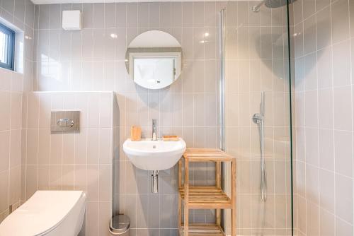 a bathroom with a sink and a shower at Chapel House in Woodbridge