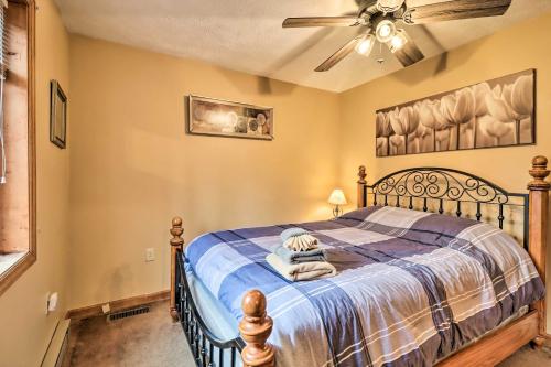 a bedroom with a bed and a ceiling fan at Game Room and Lake Access Albrightsville Home! in Albrightsville