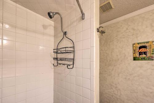 a shower with a towel rack in a bathroom at Stunning Rogers Villa with Pond about 7 Mi to Lake in Rogers