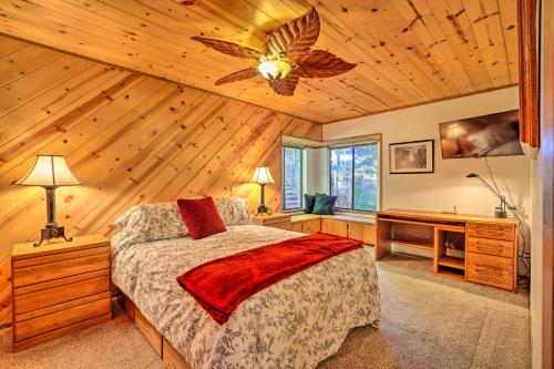 a bedroom with a bed and a wooden ceiling at Quiet and Cozy Twain Harte Cabin with Forest View in Twain Harte
