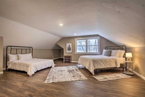 a bedroom with two beds and a window at Lakefront Minocqua Getaway Dock, Game Room! in Minocqua