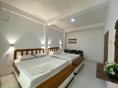 Katil atau katil-katil dalam bilik di Safari Garden Rest Udawalawa
