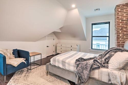 a bedroom with a bed and a chair and a window at Grand Long Branch Home 1 Block to Beach! in Long Branch