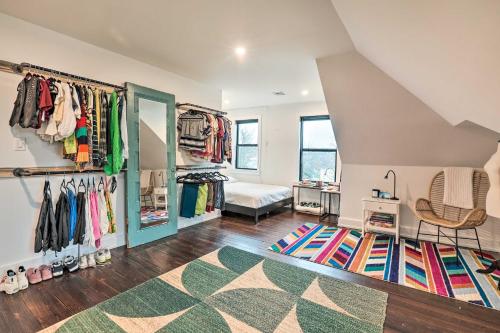 a room with a bed and a closet with a rug at Grand Long Branch Home 1 Block to Beach! in Long Branch