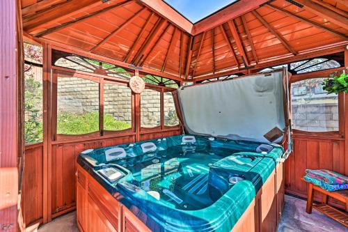 a jacuzzi tub in a wooden house at Chula Vista Studio with Hot Tub about 9 Mi to Downtown in Chula Vista