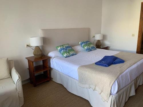 a bedroom with two beds with pillows on them at Boutique Hotel El Tio Kiko in Agua Amarga