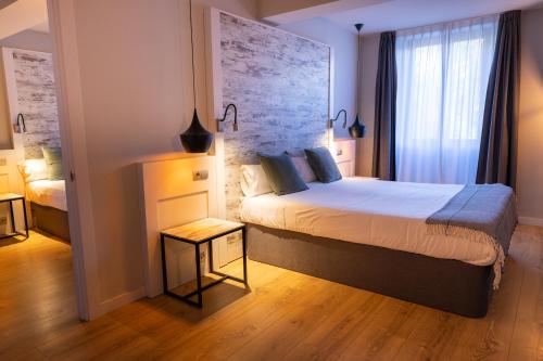 Letto o letti in una camera di Hotel Cims de Camprodon