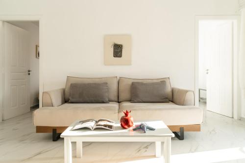 a living room with a couch and a table at Alasthas in Gavrion