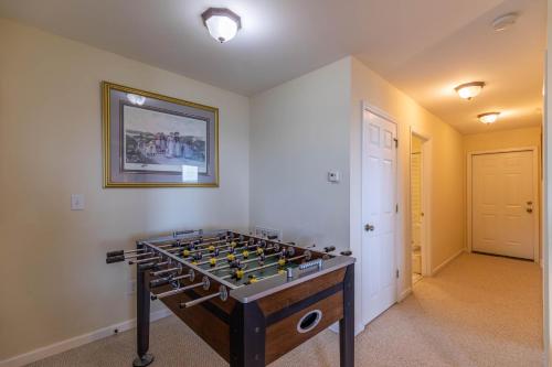 a game room with a foosball table in the corner at Hangin' Out in Blowing Rock