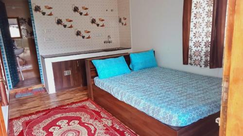 Ένα ή περισσότερα κρεβάτια σε δωμάτιο στο SAMS Cottage - Kodaikanal