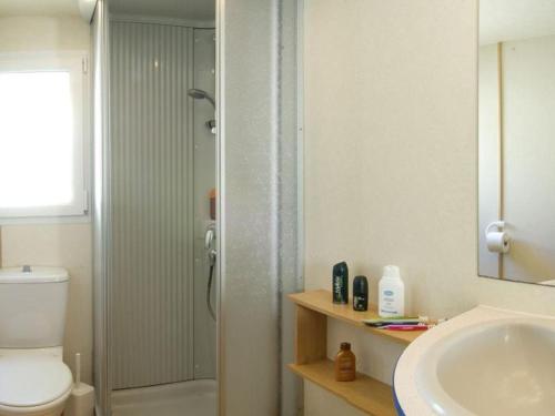 a bathroom with a shower and a toilet and a sink at Le sorgenti - Mobile Home 55 in Palazzuolo sul Senio