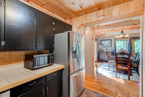 a kitchen with a refrigerator and a dining room at Crystal View in Valle Crucis