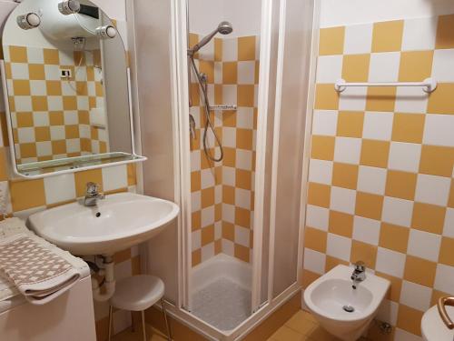 a bathroom with a sink and a shower at Ciasa Buro - Coba in Moena