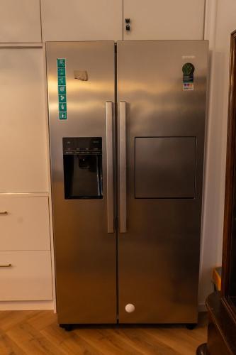 a stainless steel refrigerator in a kitchen at GOLDIE in Zagreb