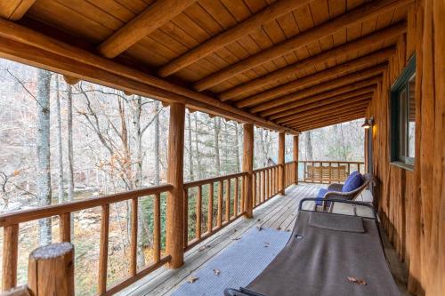 a porch of a cabin with a slide at Draggin Fly in Valle Crucis