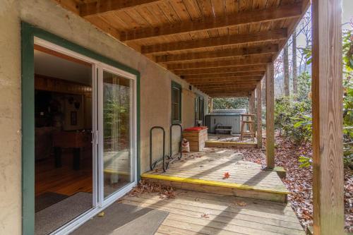 an empty porch of a house with a wooden deck at Draggin Fly in Valle Crucis