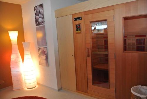 a room with a door and a lamp next to it at Haus Christopherus in Klösterle am Arlberg