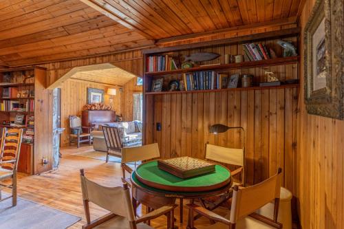 a dining room with a table and chairs in a cabin at Beech Haven in Beech Mountain