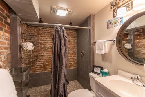 a bathroom with a shower and a toilet and a sink at Beech Haven in Beech Mountain