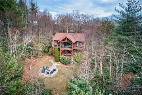 an overhead view of a log cabin in the woods at Muir Lodge in Blowing Rock