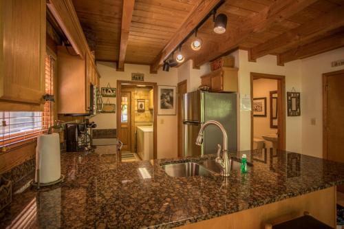 a kitchen with a sink and a counter top at Almost Heaven in Sugar Grove