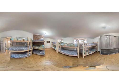 a room with a bunch of bunk beds in it at WR7 Hostel in São Bernardo do Campo