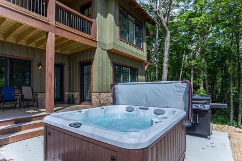 a hot tub on a porch of a house at Longview at Eagles Nest in Elk Park