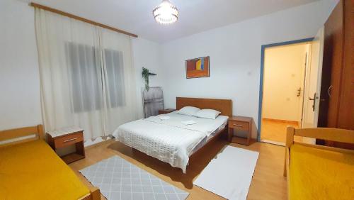 Una cama o camas en una habitación de Vojinovic Apartments