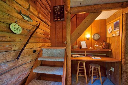a room with a desk and stairs in a cabin at Winds Aloft in Newland