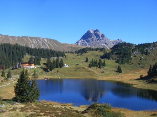 a view of a lake with a mountain in the background at Haus Christopherus in Klösterle am Arlberg