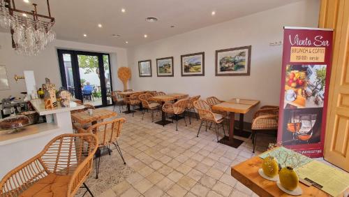 a restaurant with tables and chairs in a room at OPUNTIA Hotel Boutique in Mijas